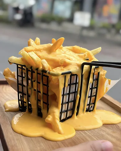 Fries covered in melted cheese sauce